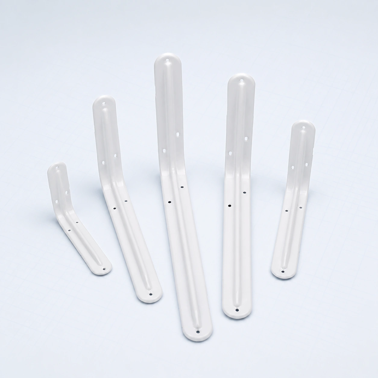 Five white round-end metal shelf brackets on a pale ice-blue studio background