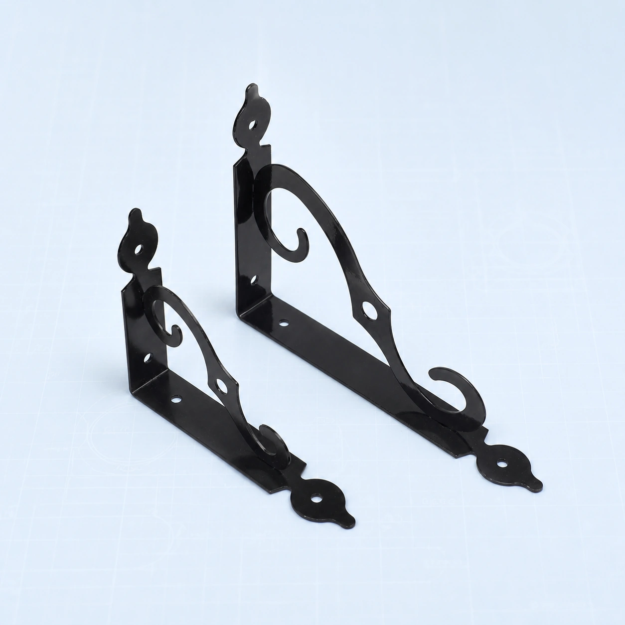 S-shaped decorative metal shelf bracket on a pale ice-blue studio background