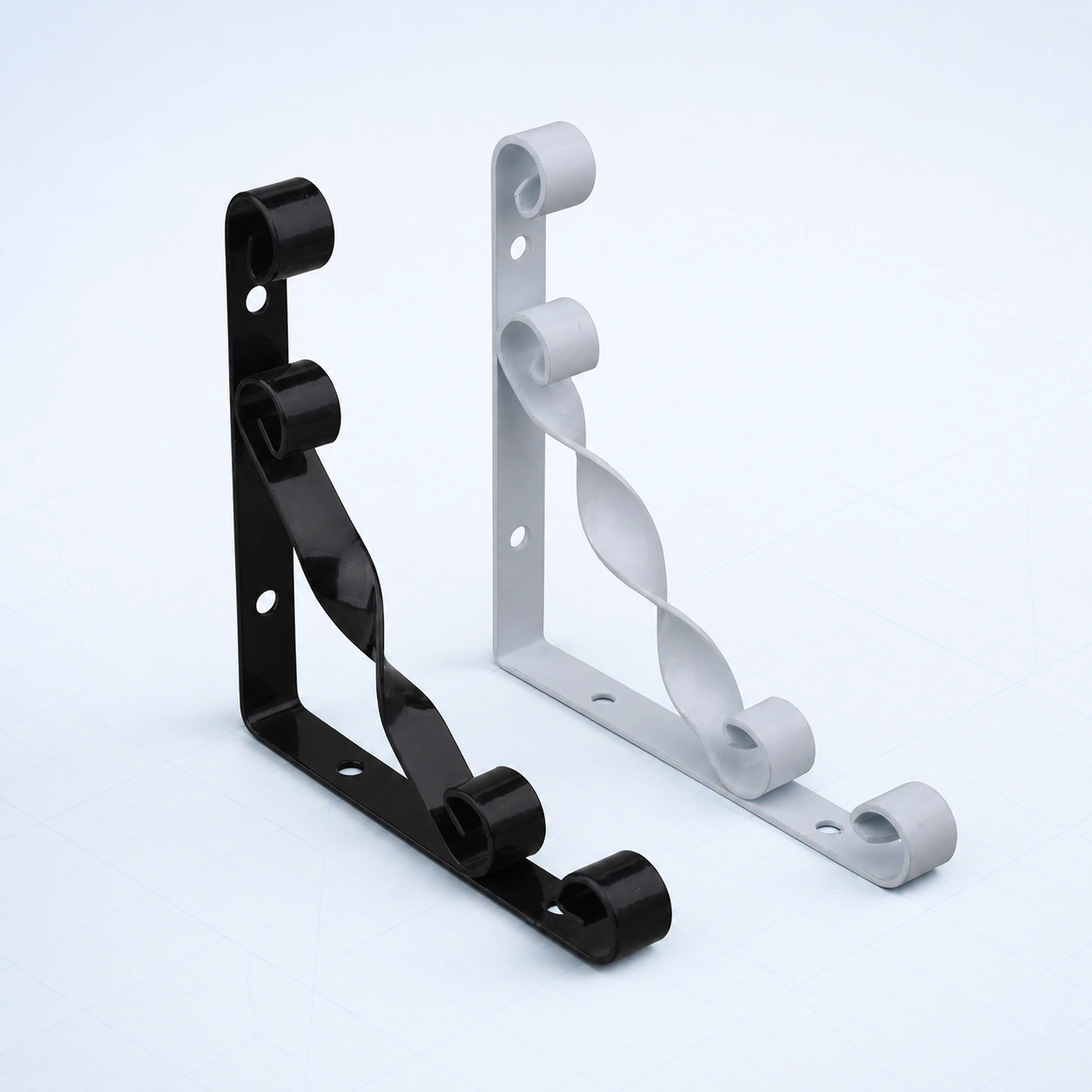 Twisted decorative metal shelf bracket on a pale ice-blue studio background
