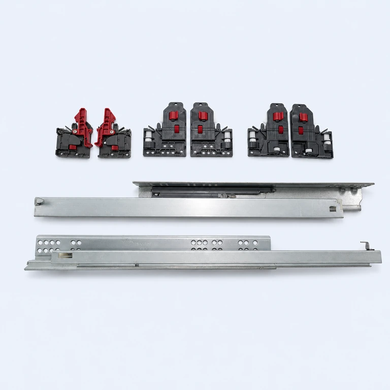 Metal undermount drawer slides with black and red locking devices on a pale ice-blue background